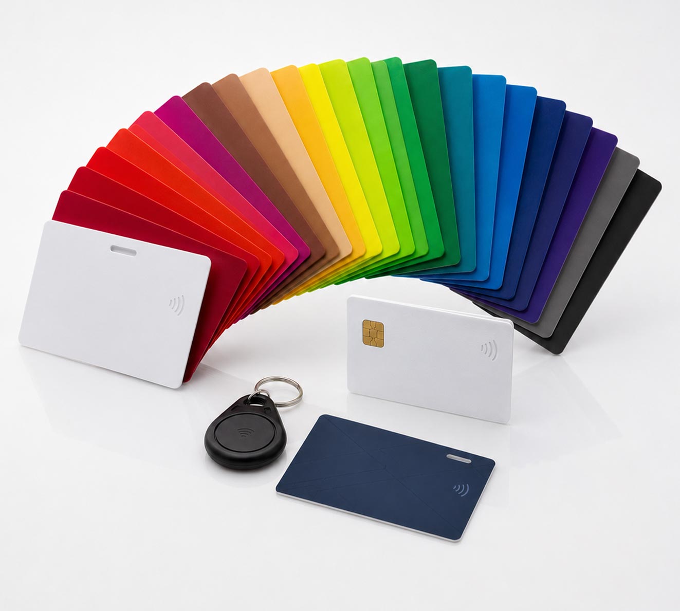 ID Card Printers, Smart Cards & Printer Service in Dayton, OH | ID CardSolutions - Fanned rainbow of color cards with embedded RFID chips, plus a few white and blue cards and a black RFID key fob nearby